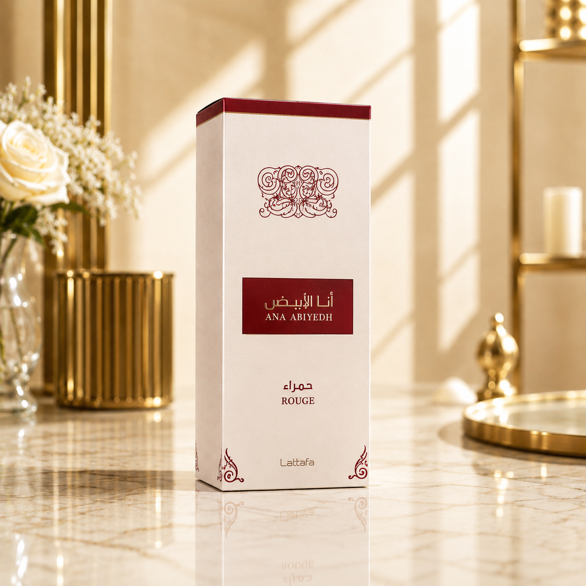 Boîte du parfum Lattafa Ana Abiyedh Rouge dans un décor luxueux sur une surface en marbre.