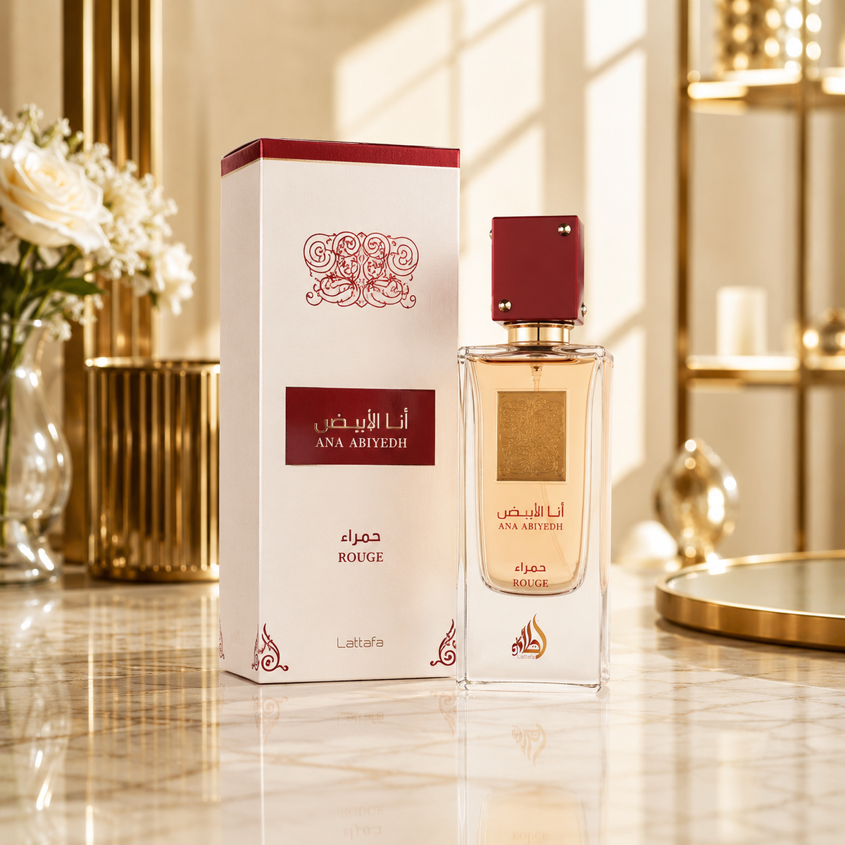 Parfum Lattafa Ana Abiyedh Rouge avec son flacon et sa boîte dans un décor luxueux sur une surface en marbre.